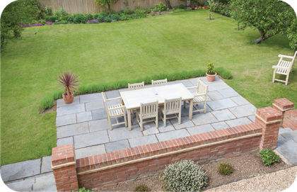 An aerial view of a patio with a table and chairs