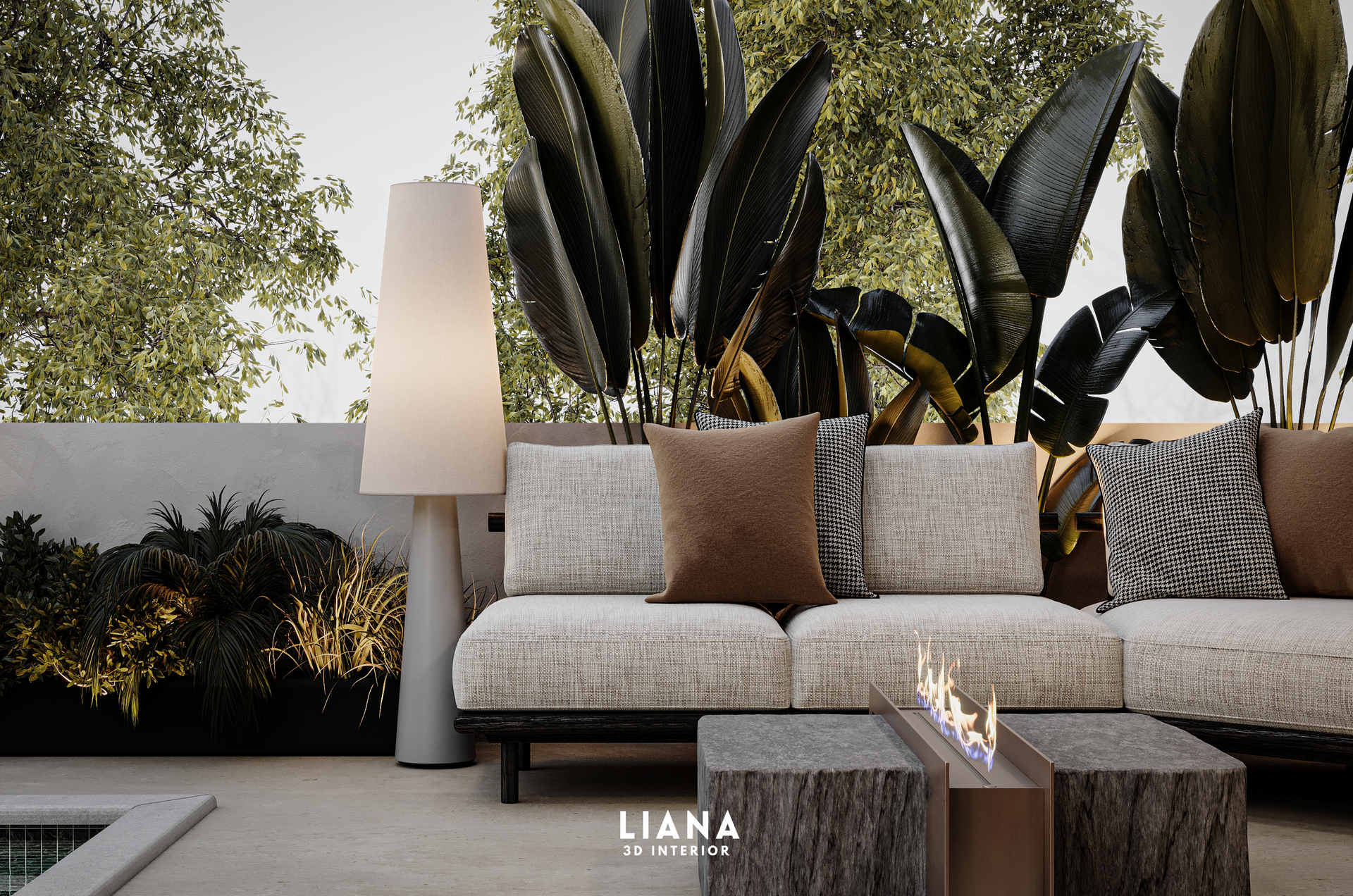Outdoor lounge with a white sofa, brown pillows, and stone coffee table with lush greenery.
