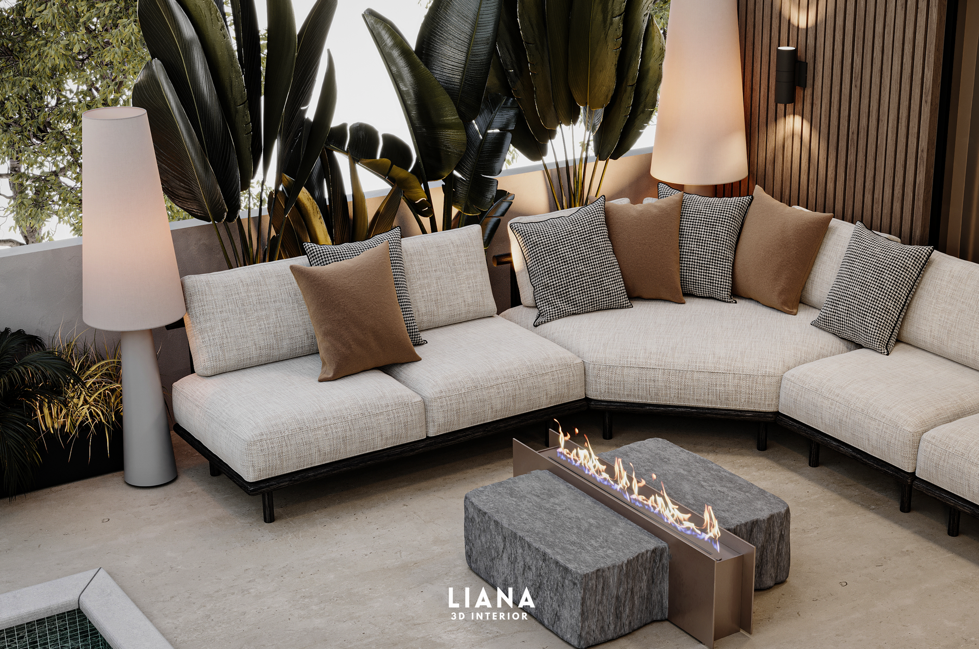 Outdoor seating area with white sectional sofa, stone coffee table with fire, and lush greenery.