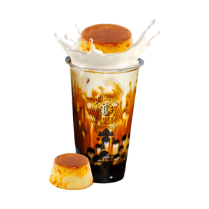 Brown sugar milk tea with a flan topping, and a splash of milk, next to a flan.