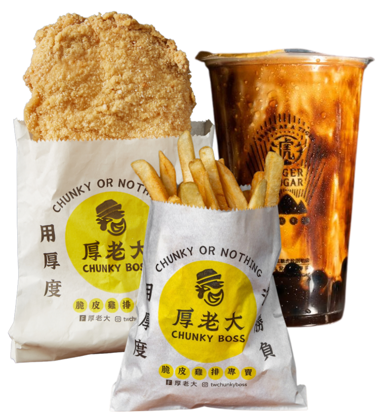 A meal from Chunky Boss: fried chicken, fries in paper bags, and a bubble tea drink.