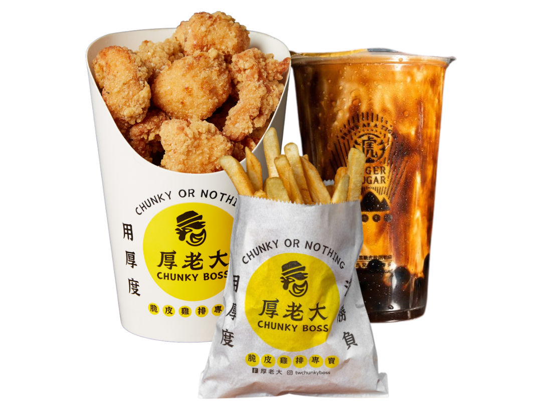 A meal from Chunky Boss restaurant with popcorn chicken, french fries, and a bubble tea drink.