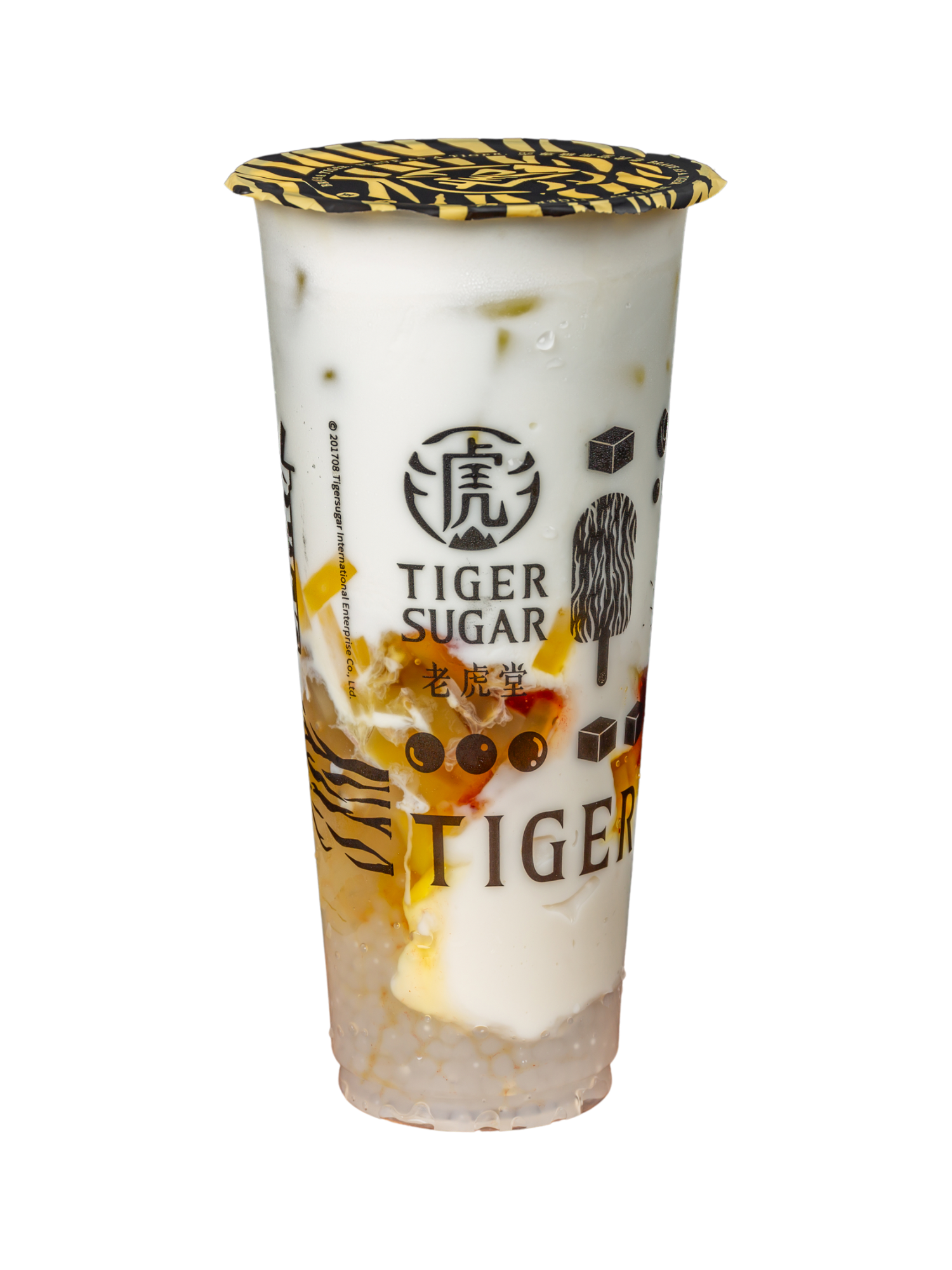 Tiger Sugar drink in a clear plastic cup with a black and gold lid; white, yellow, and brown layers visible.