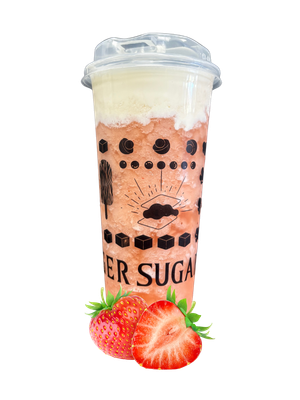 Strawberry slushy drink in a tall cup, topped with cream, and decorated with strawberries.