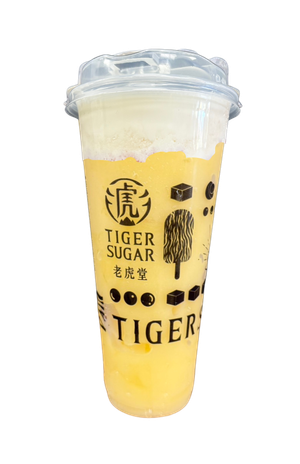 A mango-colored drink in a clear plastic cup with a white foam topping. The cup has the Tiger Sugar logo and branding.