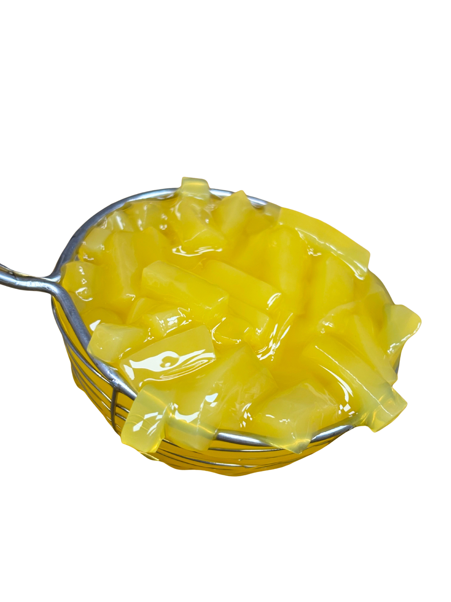 Yellow pasta in a metal strainer, close-up, against a white background.