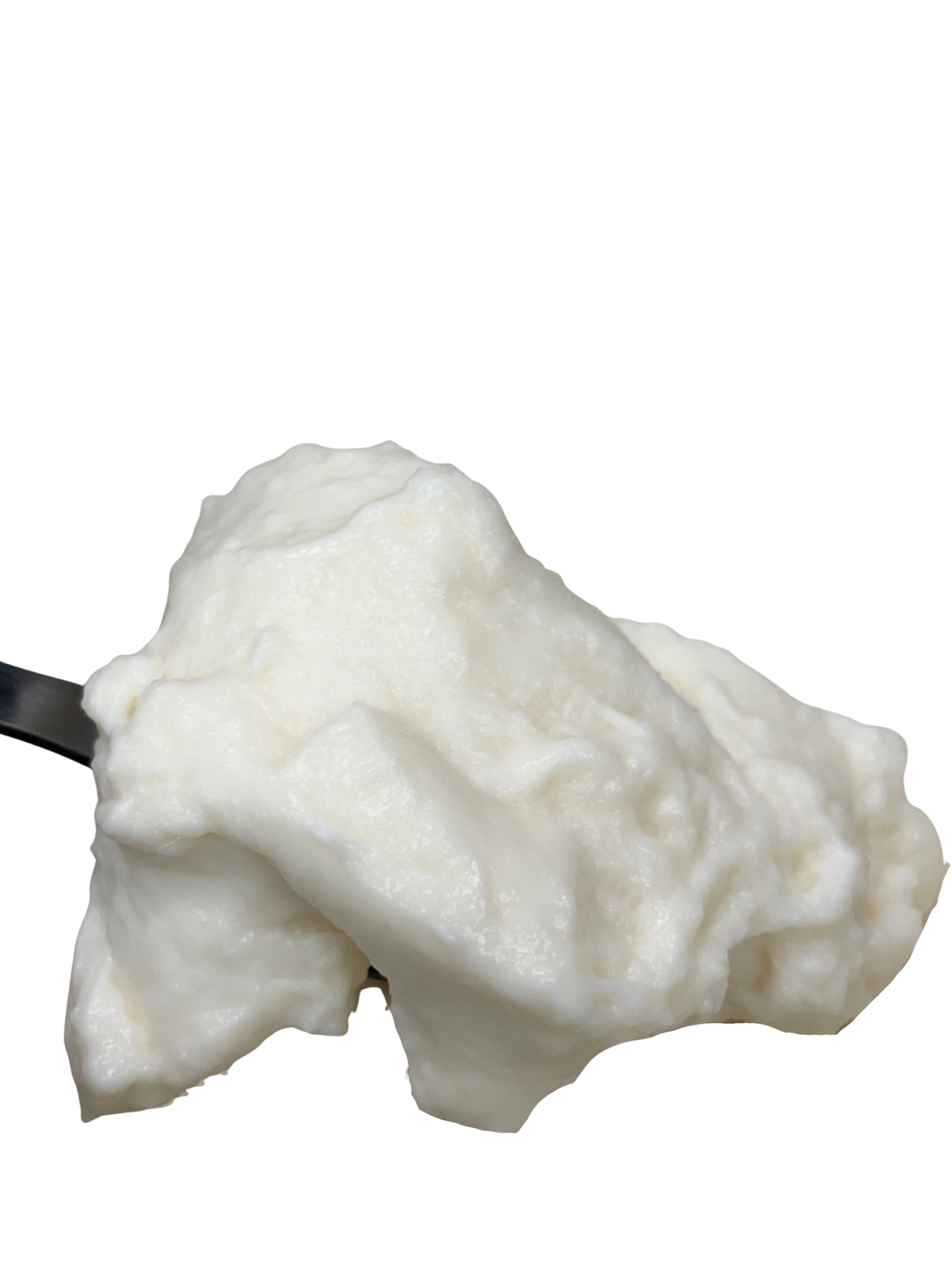 Whipped egg whites on a metal spatula, light and airy.