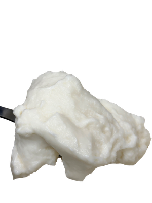 Whipped egg whites on a metal spatula, light and airy.