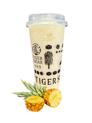 A Tiger Sugar pineapple smoothie in a clear cup, with pineapple slices and leaves.