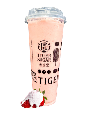 A strawberry smoothie from Tiger Sugar, pink with tapioca pearls, and a strawberry in front.