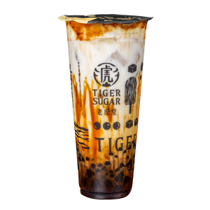 Tiger Sugar brown sugar boba drink with brown sugar stripes on the cup, milk and ice.