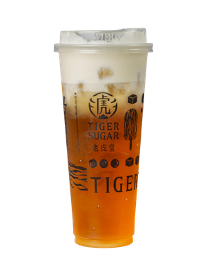 A tall, clear plastic cup of Tiger Sugar tea, layered with a white cream topping and ice, on a white background.