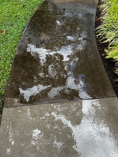 A sidewalk with a lot of water on it