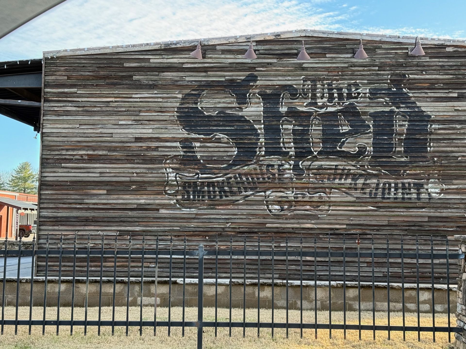 A wooden building with a sign that says street on it