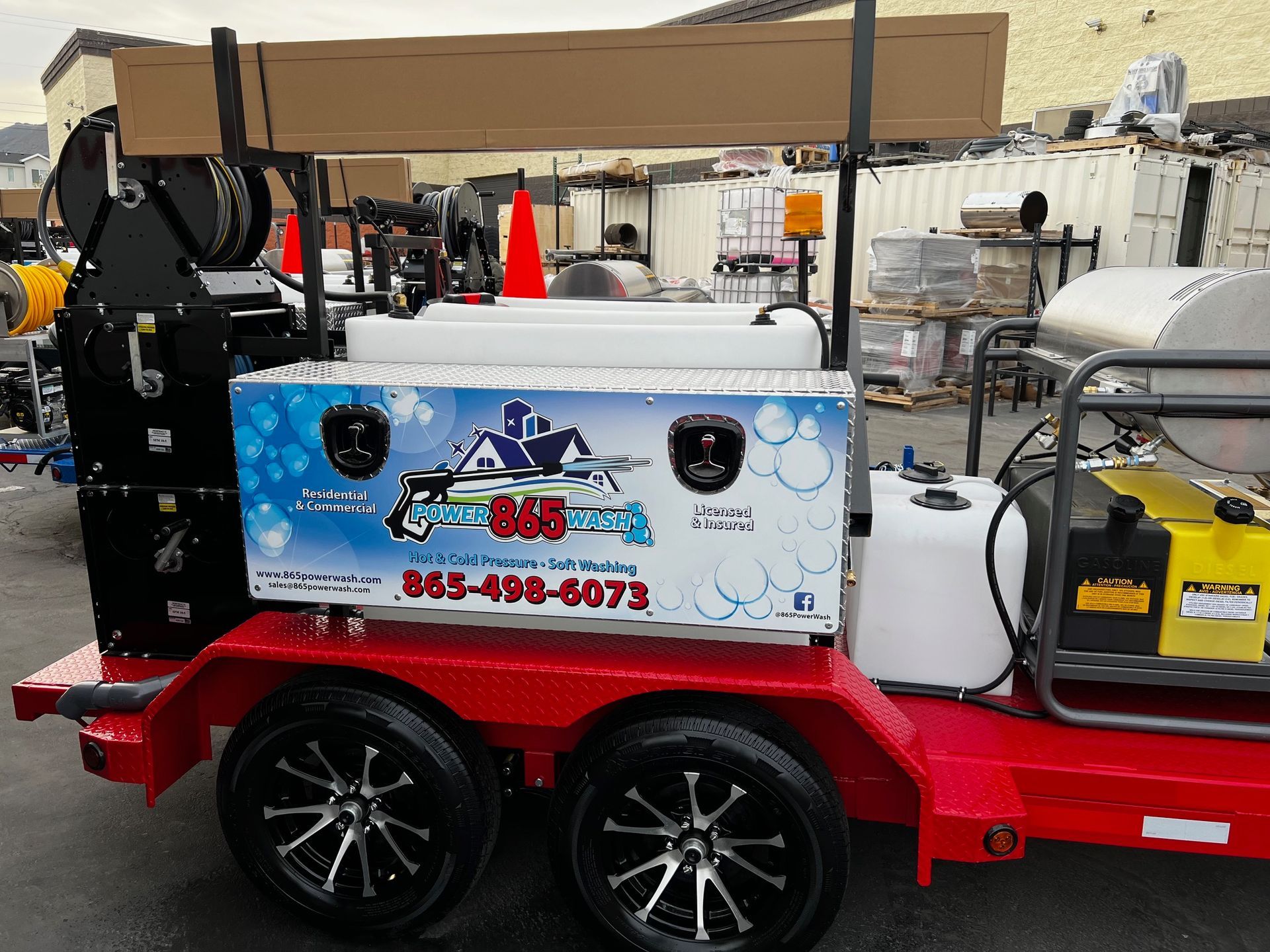 A trailer with a box on it that says 865-498-6073 865 Power Wash equipment