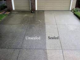 A before and after picture of a concrete driveway that has been sealed.