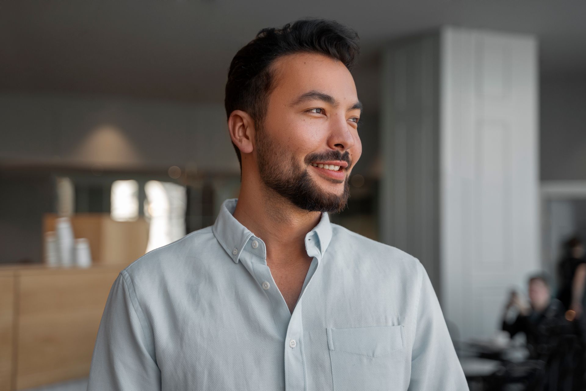 A wooden bench on the deck of a boat looking out over a lake.