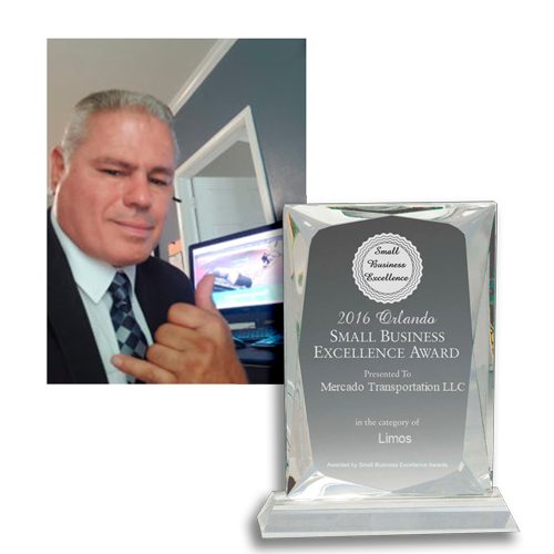 Man giving a thumbs up pose with award. 2016 Orlando Small Business Excellence Award.