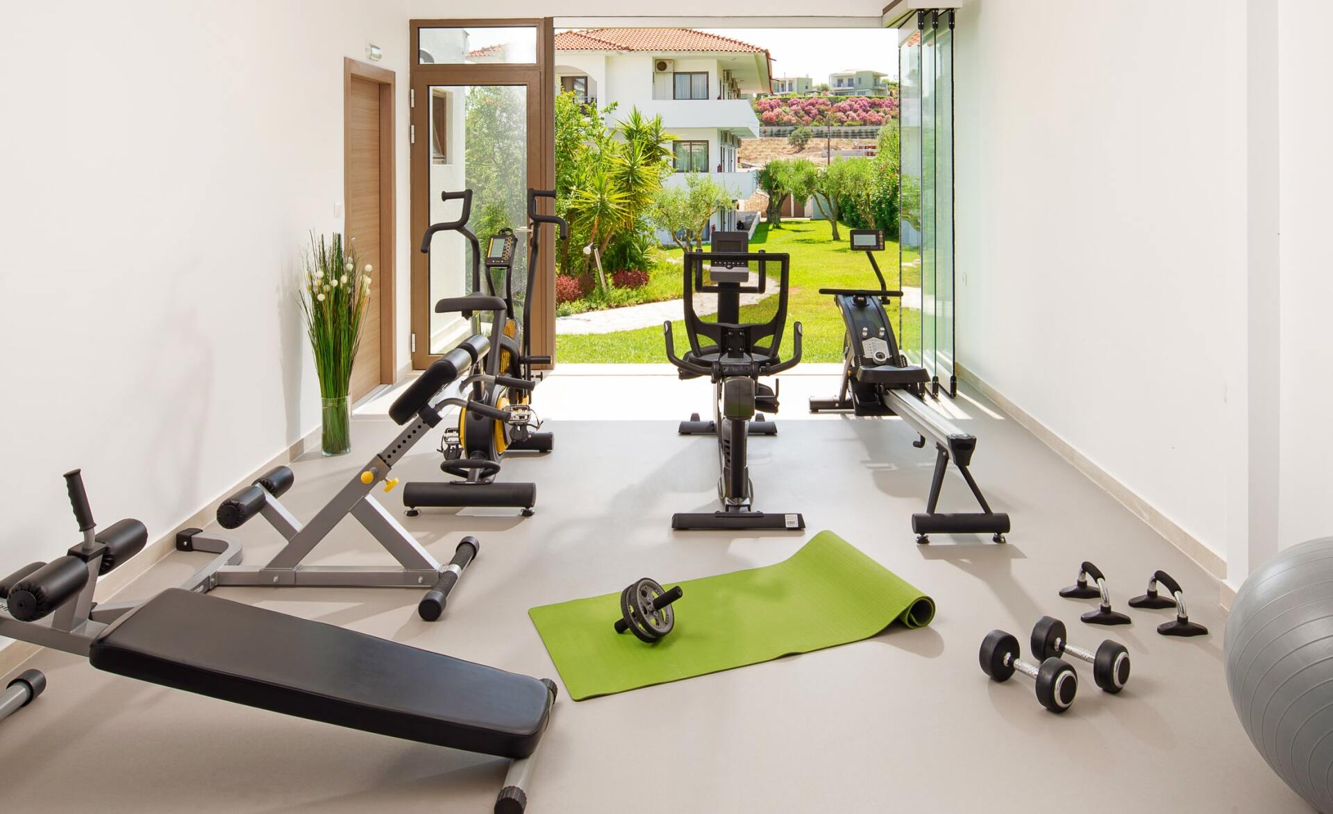 home gym addition with windows by NanaWall company. picture taken in  a home in Saratoga CA
