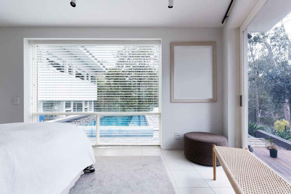 There is a Swimming Pool in the Background of the Bedroom — Lismore Blinds in North Lismore, NSW