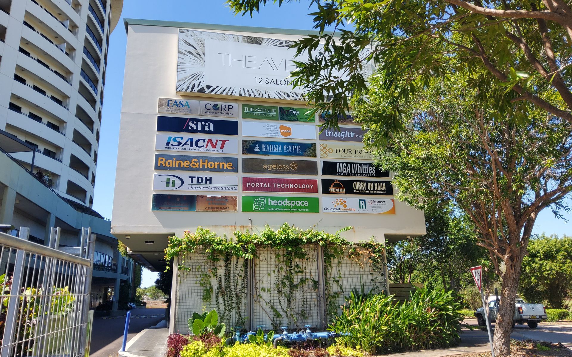 Signage of Various Businesses on a Building Exterior — Neil Griffiths Rendering in Berry Springs, NT