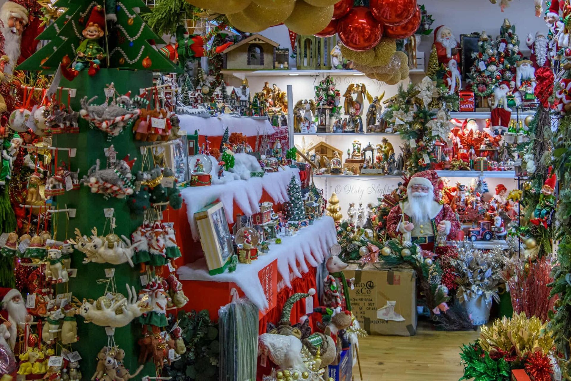 A christmas store filled with lots of christmas decorations.
