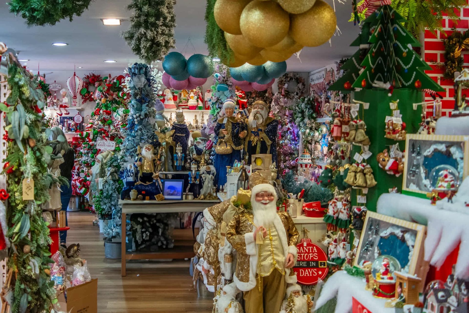 A christmas store filled with lots of christmas decorations.