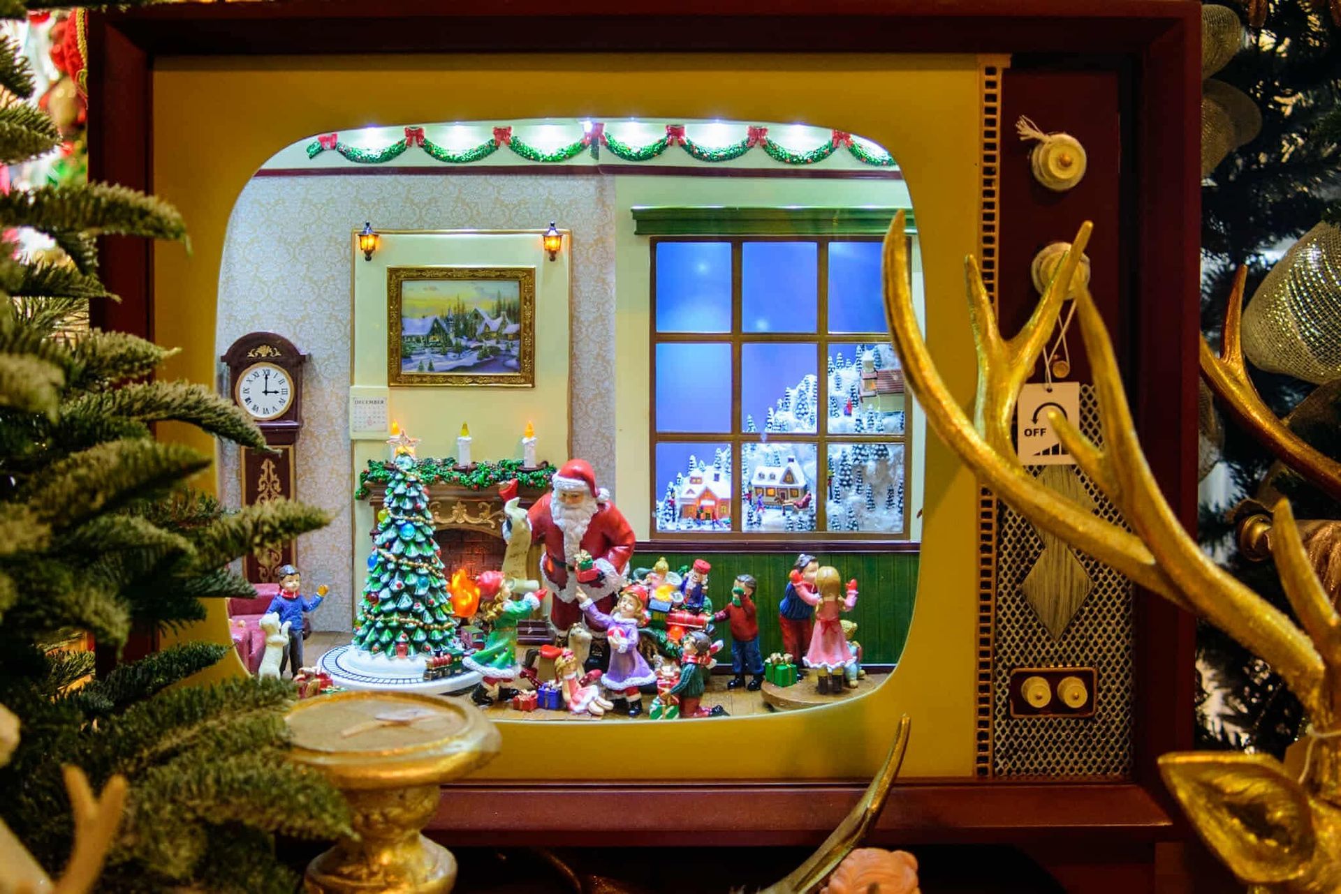 A christmas scene is displayed on a television screen.
