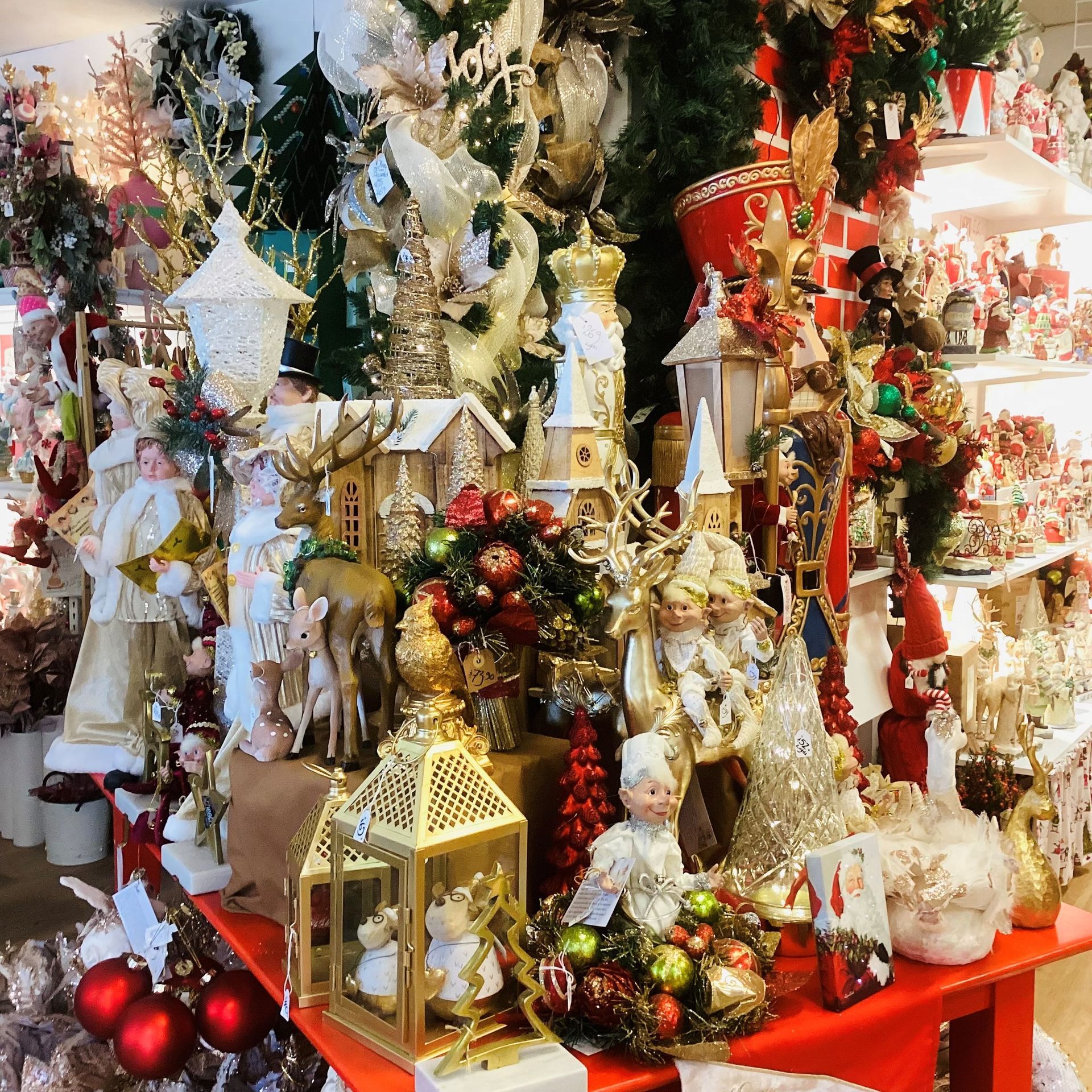 A table full of christmas decorations including a lantern