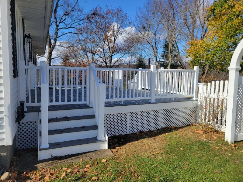 A group of men are working on a wooden deck.