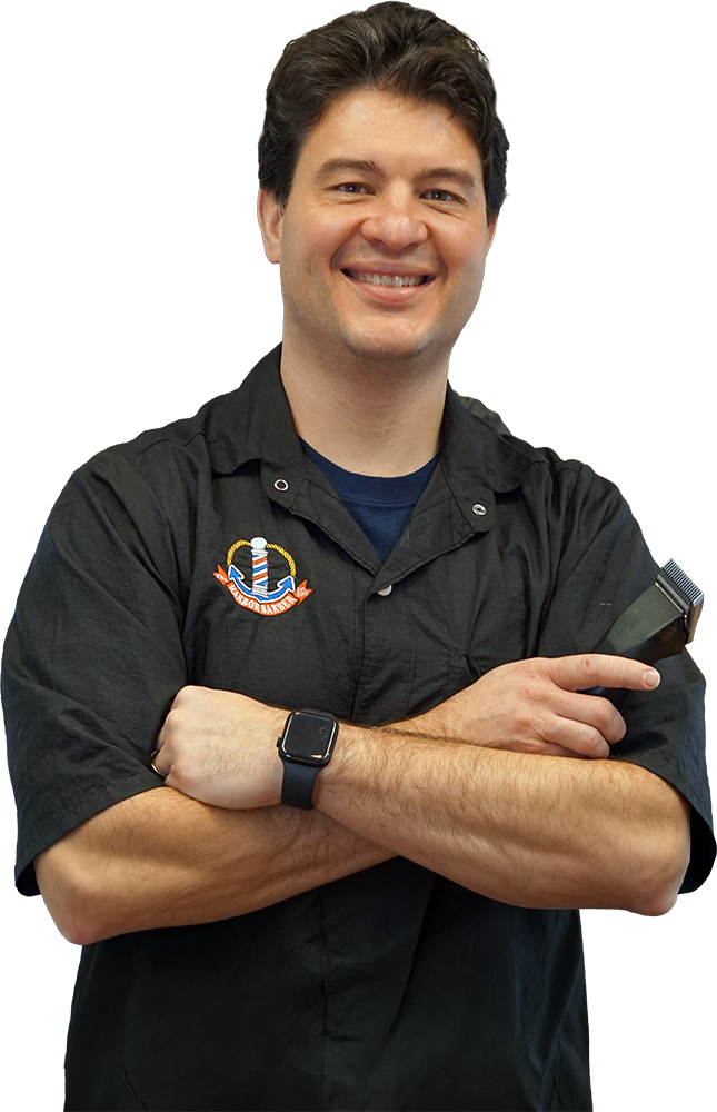 A portrait of Jordan Dutcher, owner of The harbor Barber in Harbor Springs, MI.