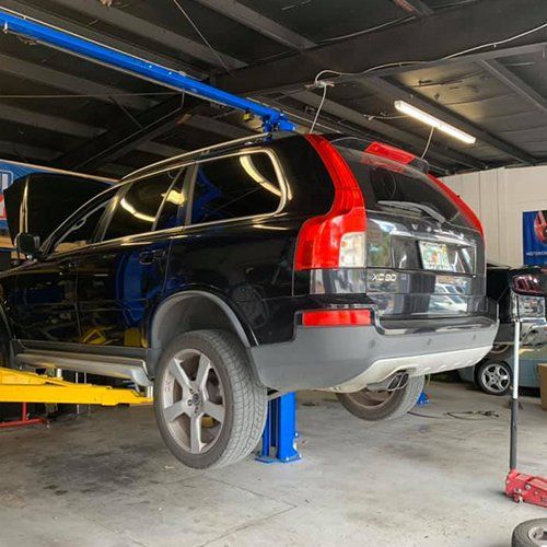 Towing — Elevated Car Getting Fixed in Orange Park, FL