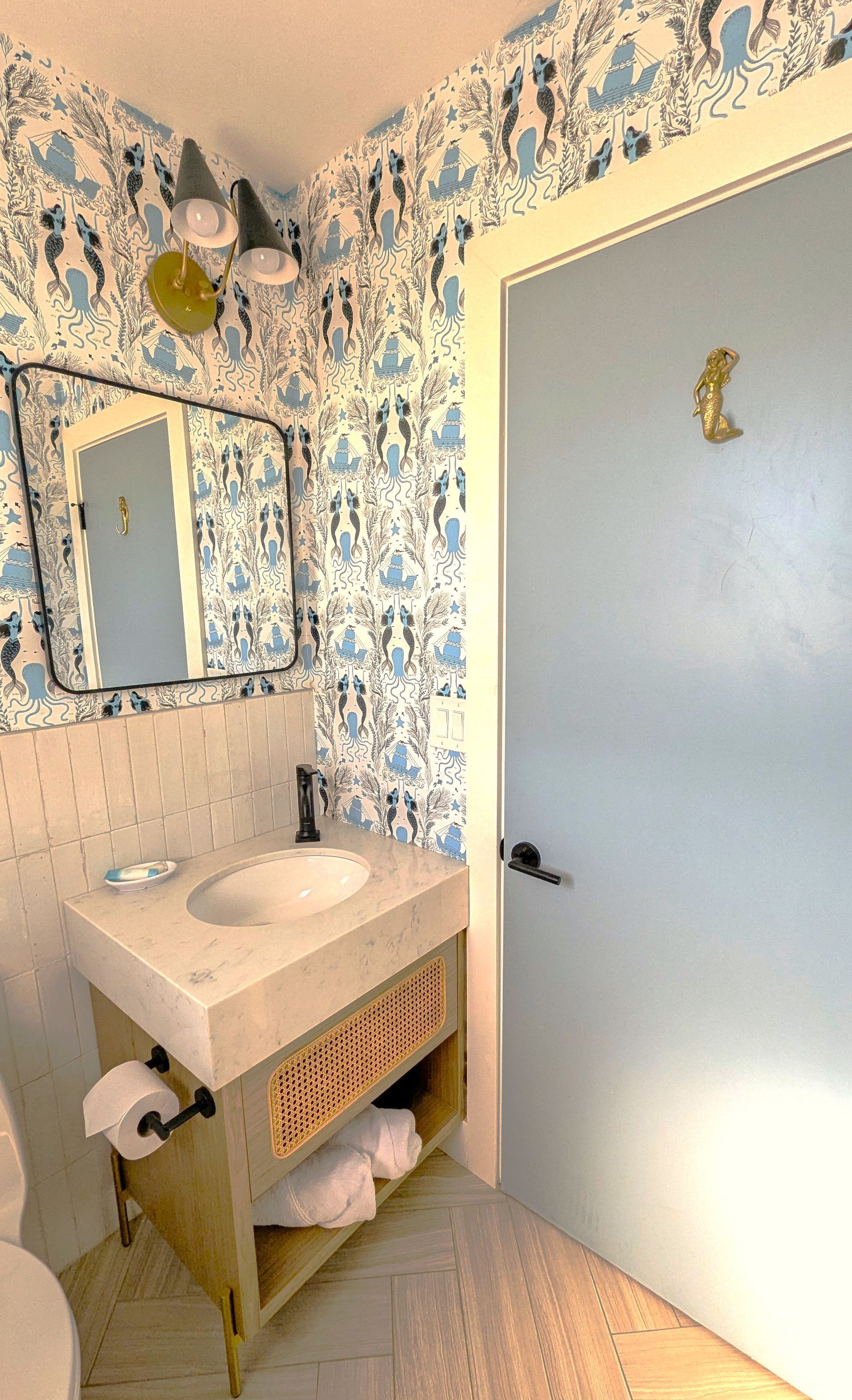 Shower with marble and black plumbing fixtures