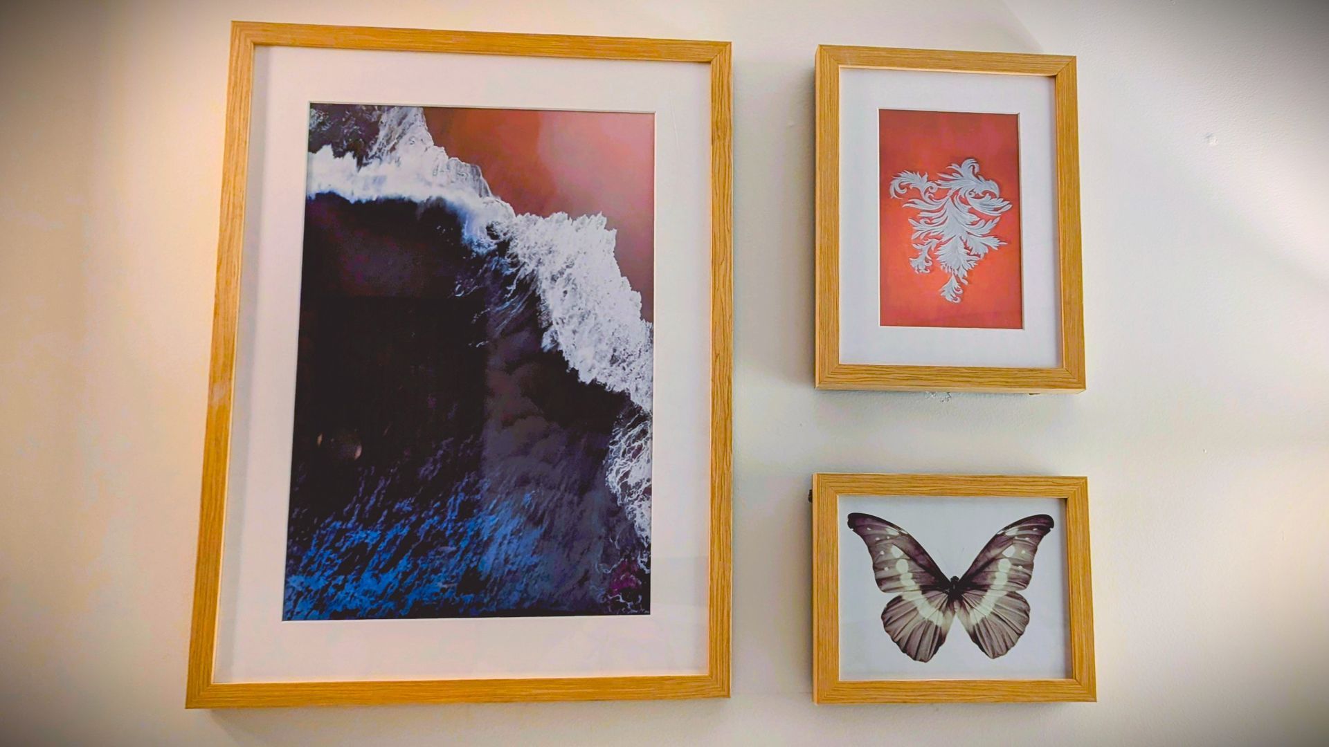 Three pieces of framed artwork