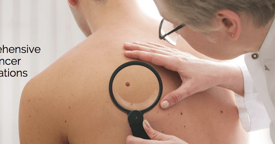 A woman is examining a man 's back with a magnifying glass.