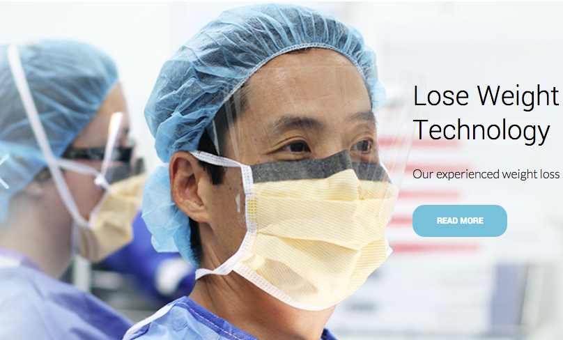 A surgeon wearing a mask and a surgical cap.