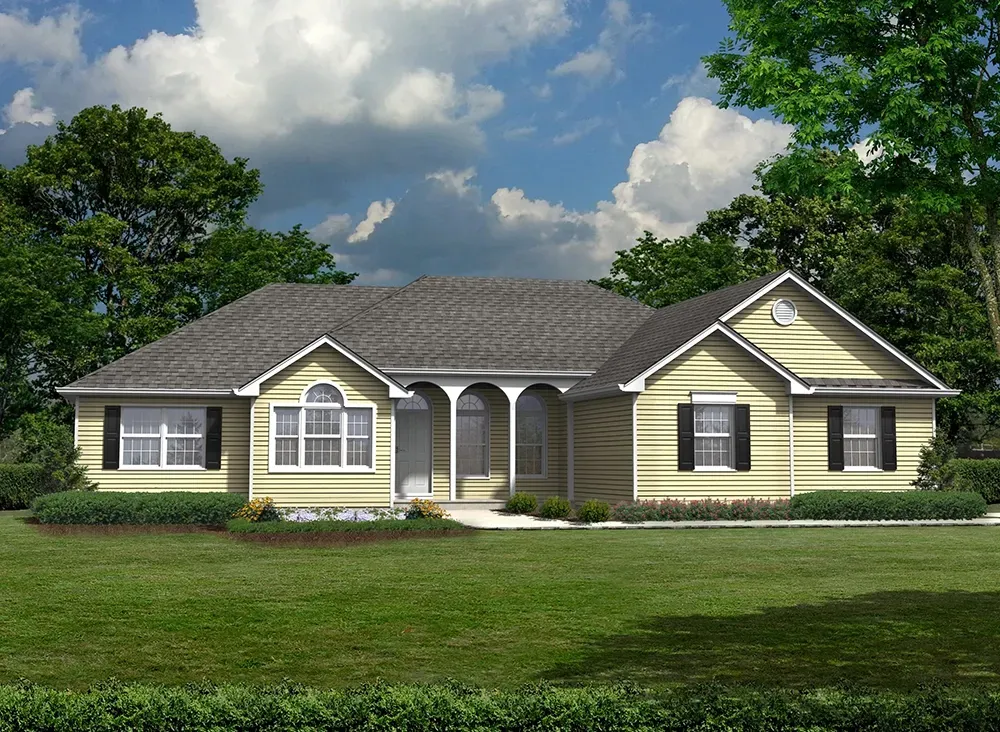 A single-story, yellow-sided suburban house with a gray shingled roof, arched entryway, and a lush green lawn.