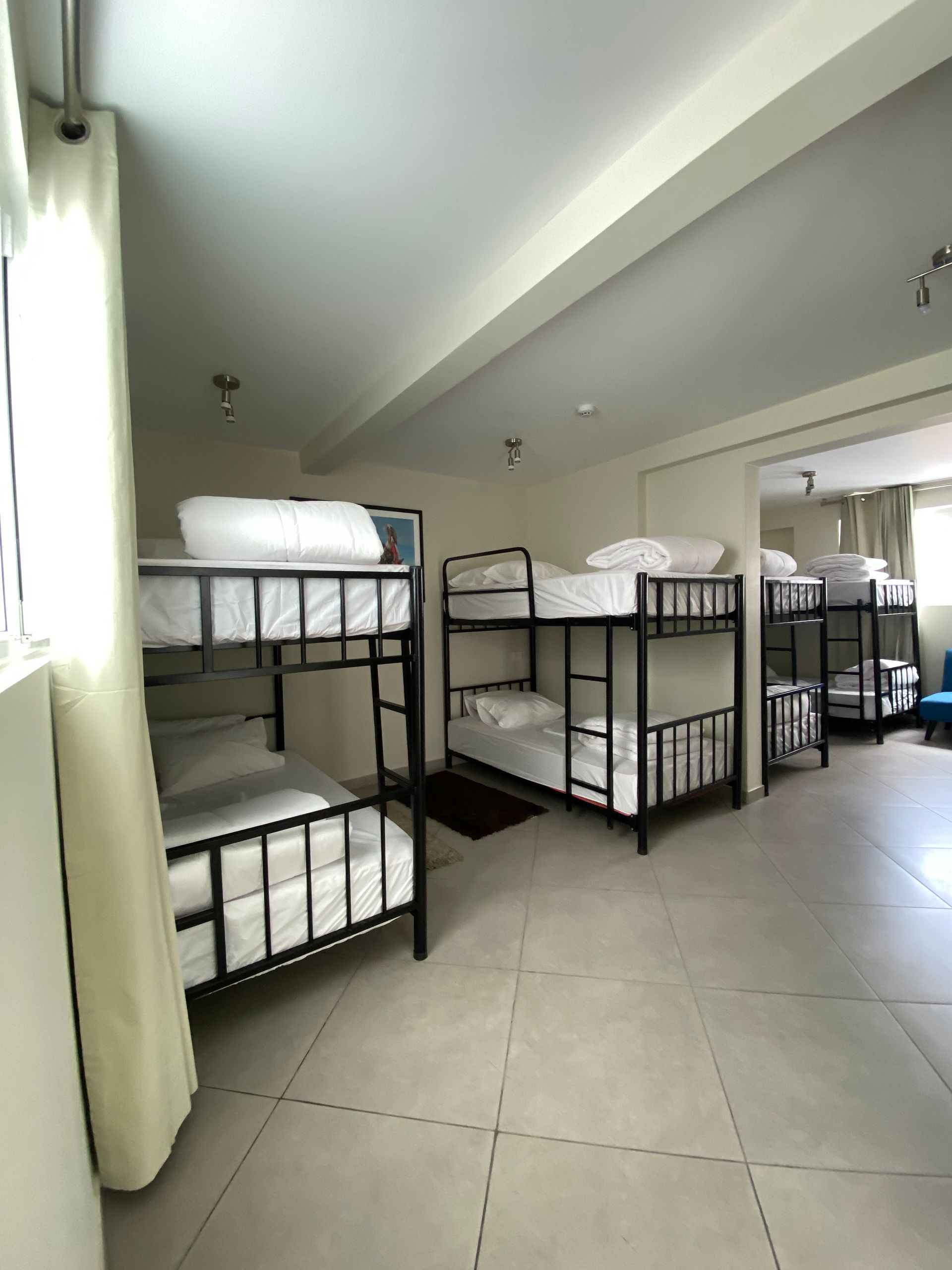 A room with a lot of bunk beds in it