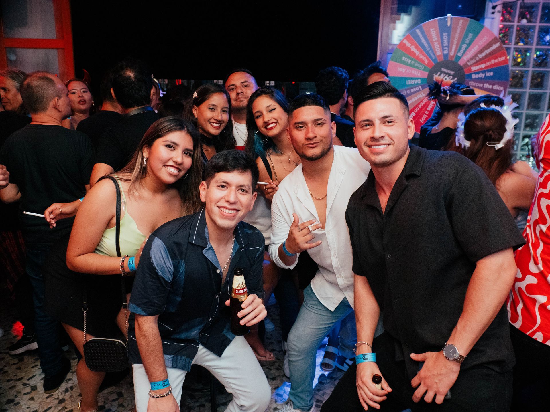 A group of people are posing for a picture at a party.