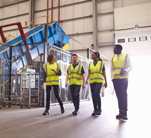 Image of people walking in a warehouse