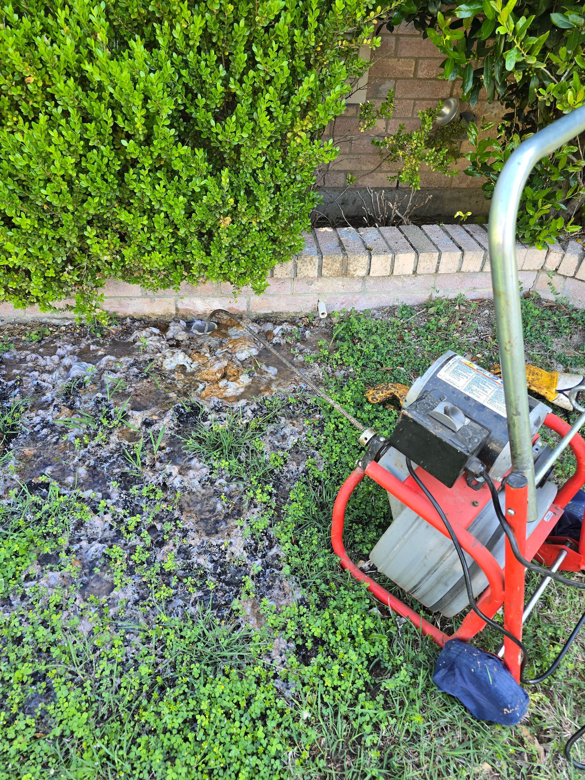 Drain cleaning sewer machine clearing main line clog in Midlothian TX