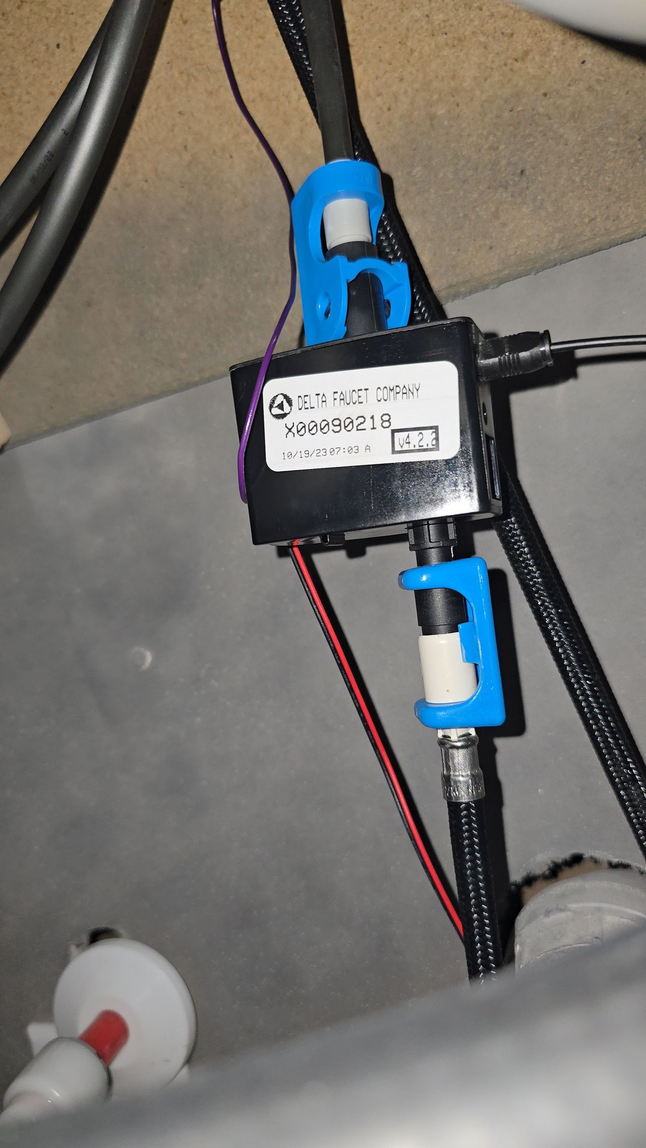 Black and blue electronic device with wires and coaxial cables.