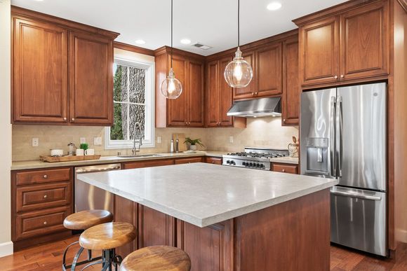 Luxury kitchen with stained cabinets.