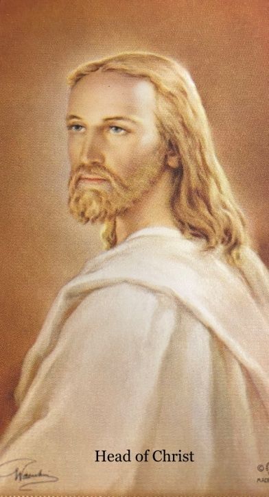 A painting of jesus with the caption head of christ