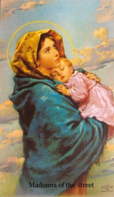 A painting of madonna of the street holding a baby