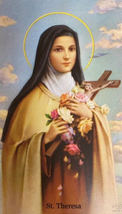 A painting of st. theresa holding flowers and a cross