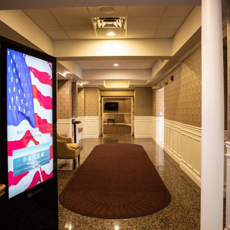 A hallway with an american flag on the wall