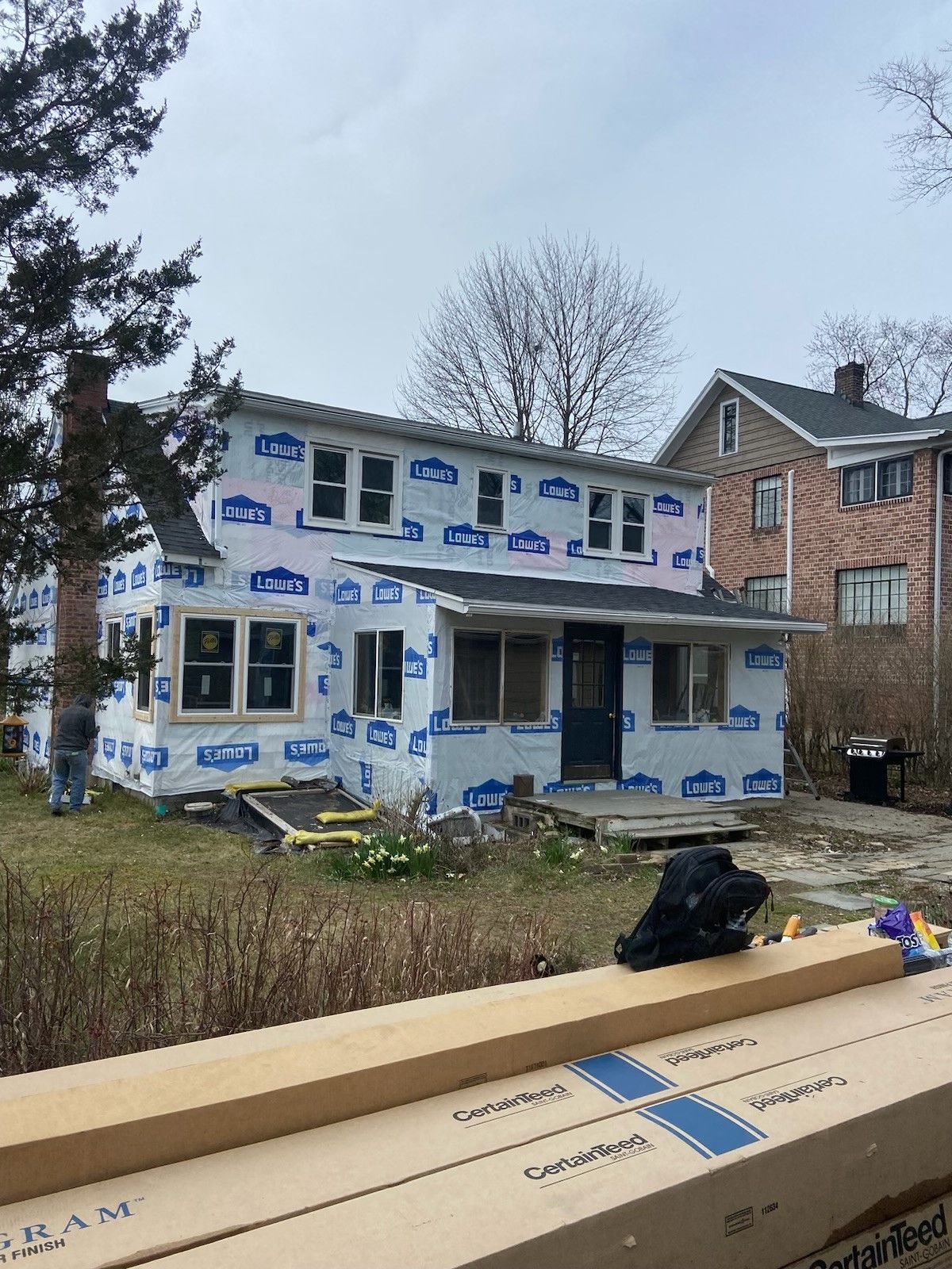 A house with a lot of windows is being remodeled.  - Kingston, NY - JMD Home Improvements