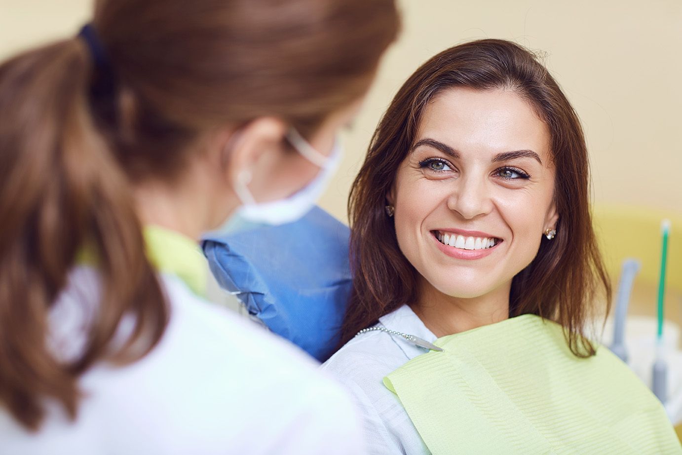 Dentist consulting with patient returning after years without dental visit in Babylon NY