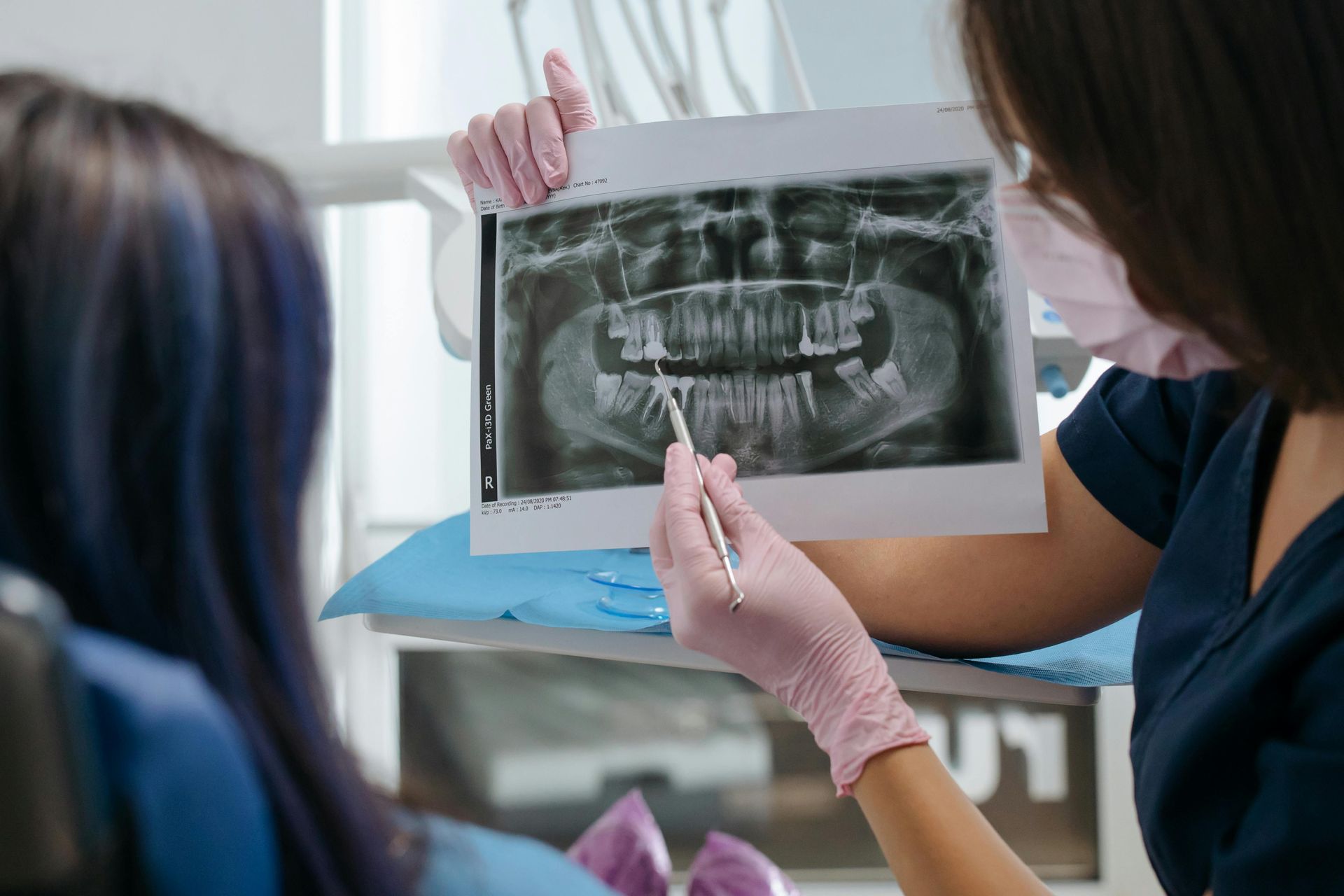 Dentist reviewing digital X-rays during a routine checkup with Dr Colleen L. Catera DMD

